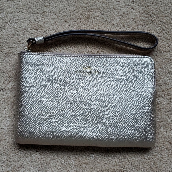 Coach Handbags - SOLD NWOT Gold Coach Wristlet